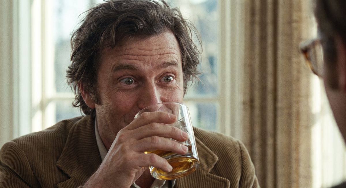 Panel 4 del storyboard. Mark takes a deliberate first sip, freezes in surprise, and lowers the glass with wide eyes as the distinct, smooth real-sugar flavor hits his palate.